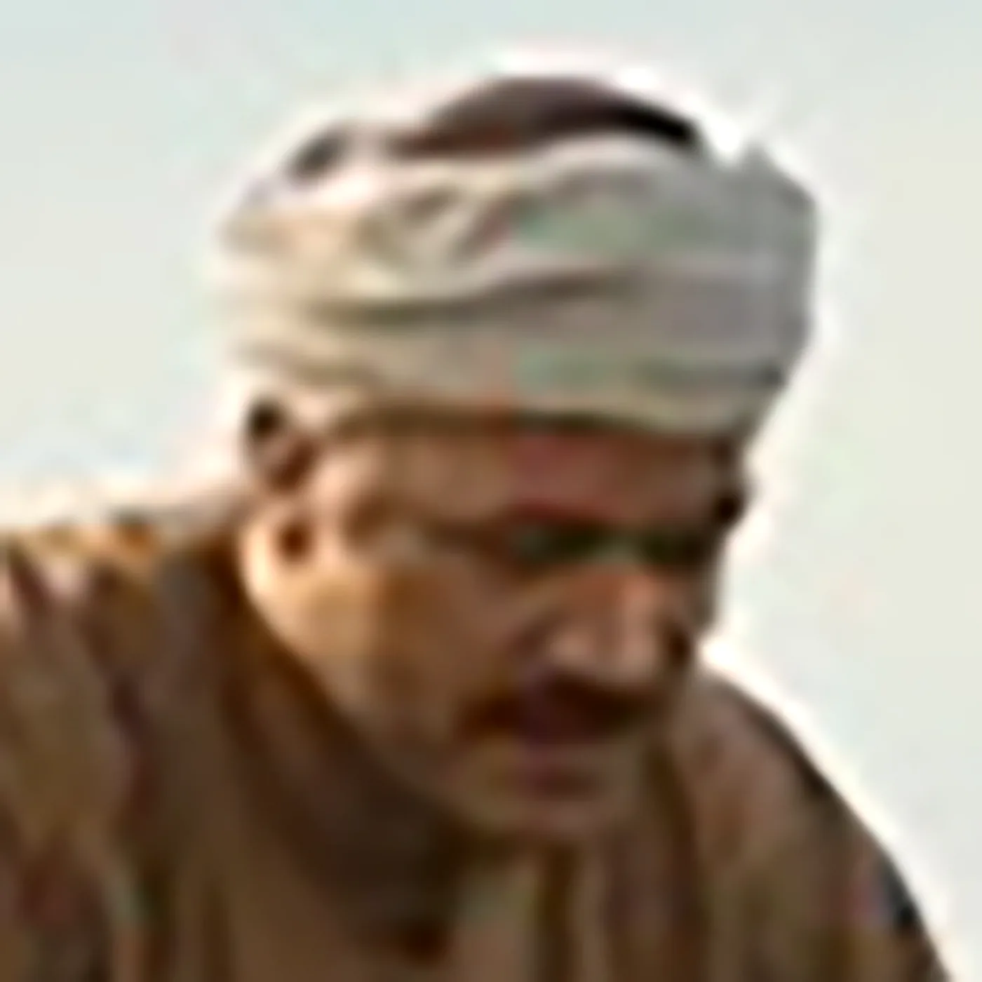 Blurry, low-quality photo of a farmer before enhancement